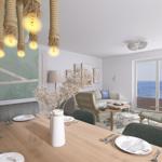 Essbereich mit Blick aufs Meer und Wohnbereich mit Sitzgelegenheiten.