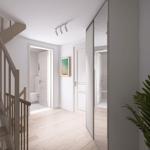 Eingangsbereich mit Holztreppe, Pflanze und Blick in Schlafzimmer und Bad.