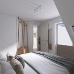 Schlafzimmer mit Bett, Kleiderständer und Fenster. Decke geneigt.