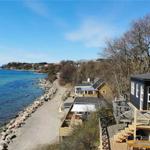 House by the sea with terrace and view of the coast.