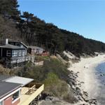 Houses by the beach with view of the sea and forest