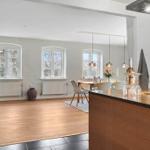 Kitchen with wooden island and dining area with table and chairs