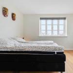 Bedroom with bed, window and wall decoration