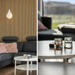 Living room with gray sofa, wooden wall, and round tables