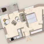 Wohnung mit Schlafzimmer, Küche und Bad. Terrasse mit Sitzgelegenheit.