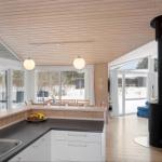 Kitchen with dining area and view of snow