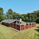 Red wooden house with terrace and garden