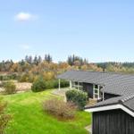 House with garden and forest view. Wooden house with terrace and satellite dish.
