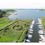 View of harbor with boats and green waterfront areas