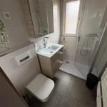 Bathroom with shower, sink and toilet
