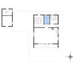 Apartment with kitchen, bedroom, and bathroom. Adjacent space as garage or shed.