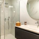 Bathroom with shower, sink and mirror