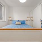 Bedroom with bed, wardrobe, and window