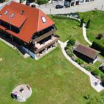 House with red roof, large garden and terrace.