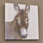 Gemälde eines Eselskopfes an der Wand