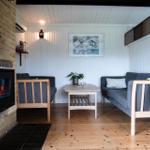 Living room with fireplace, sofa, and table