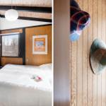 Bedroom with wooden walls, bed, and window. Hats hang on the wall.