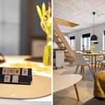 Tisch mit Zahlenblock und gelben Blumen. Wohnraum mit Tisch, Stühlen und Treppe.