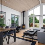 Spacious living and dining area with fireplace, seating, and dining table.