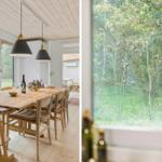 Esszimmer mit Holztisch und Stühlen, großes Fenster mit Blick auf Wald.