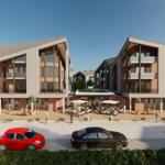 Moderne Wohnhäuser mit Balkonen und Terrassenbereich im Freien.