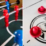 Fußballtisch und Air Hockey Tisch mit roten und blauen Spielsteinen.