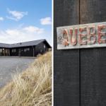 Modernes Haus mit Holzverkleidung und großem Fensterbereich. Holzschild mit Aufschrift Quebec.