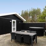 Outdoor area with table, chairs, hot tub, and grill spot