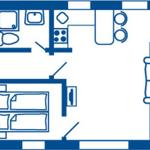 Wohnung mit Küche, Bad und Schlafzimmer. Wohnbereich mit Sofa.