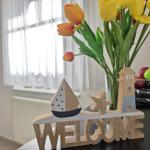 Welcome decoration with flowers and fruit on a table.