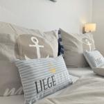 Bed headboard with pillows and wall lamp