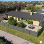 A modern house with terrace and garden. View of the surroundings.