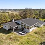 House with terrace and grill area in green surroundings