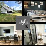 Ferienhaus Anker mit Wohnzimmer, Essbereich, Bad und Außenbereich.