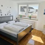 Bedroom with double bed, window, and TV.