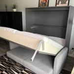 Sofa bed with storage and wall art