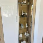 Display cabinet with model ships, seagulls, and lighthouse models