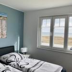 Bedroom with sea view and wall picture