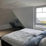 Bedroom with sea view and skylight
