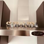 Kitchen counter with wooden sign STRAND and ship motifs.