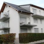 House with balconies and solar panels