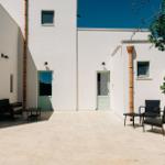 Bright terrace with seating and white walls.