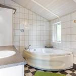 Bathroom with bathtub, sink, and shower