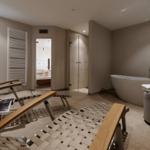 Bad mit freistehender Badewanne, Dusche und Sauna.