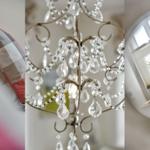 Kissen mit kariertem Stoff, Kristallleuchter und Pflanze in Korb