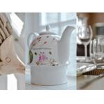 Haus mit Teekanne, Tisch und Gläsern