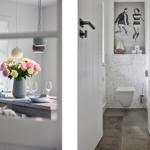 Essbereich mit Blumen und Toilettenraum mit Mosaikwand