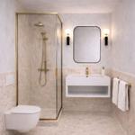 Bad mit Dusche, Waschbecken und Toilette. Goldene Armaturen und Marmorfliesen.