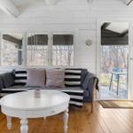 Living room with sofa, table, and view of terrace
