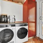 Washing machine and dryer with coffee maker and refrigerator.